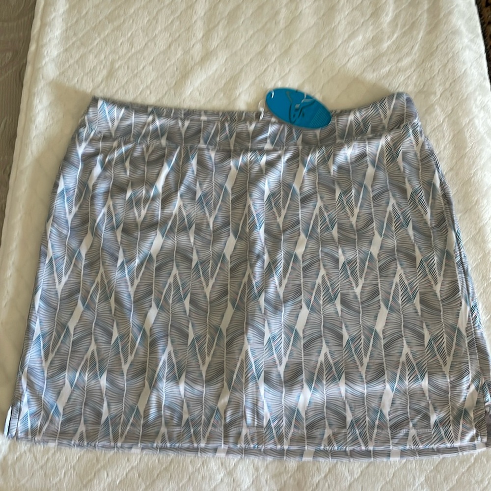 Greg Norman golf skirt with shorts. NWT